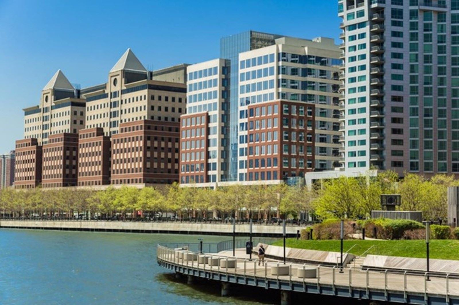 The Hoboken waterfront on the Hudson River, where SEAD's client hub sits above the riverside walkway.